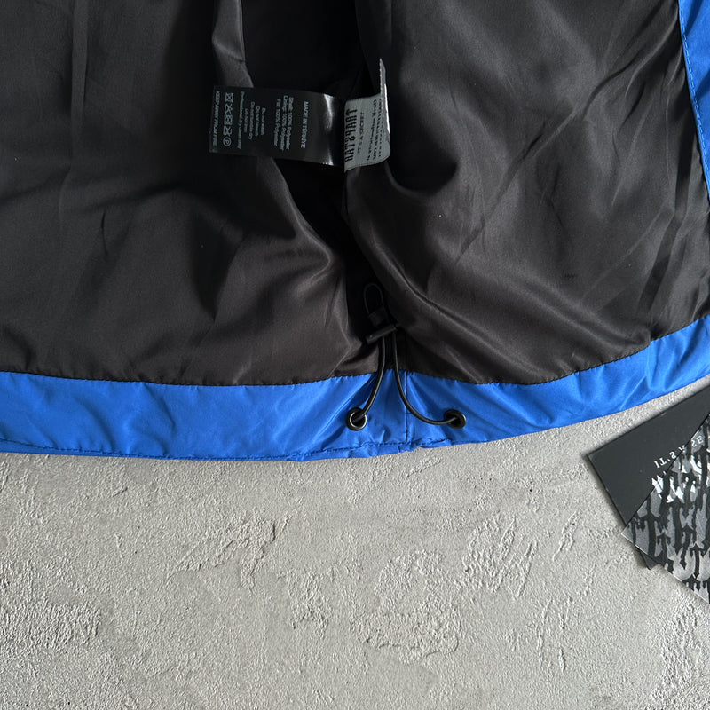 Jaqueta Trapstar "Decoded Arch Puffer Black Blue"