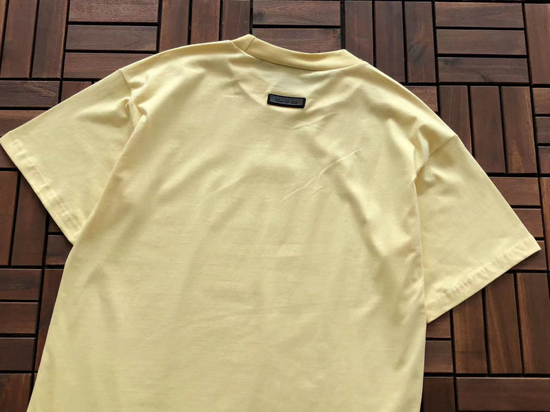 Camiseta Fear of God Essentials "S/S Yellow Leaf"