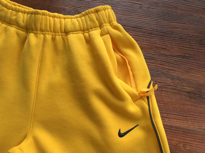 Calça Moletom Nike x Nocta “Track Fleece Yellow”